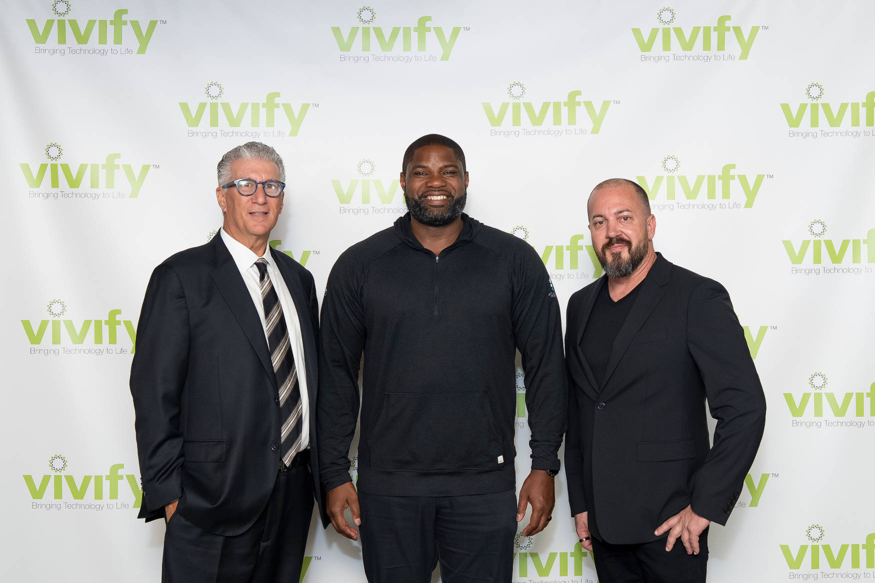 Byron Donalds stands between VIVIFY founder Jason Herring and a guest at a VIVIFY event